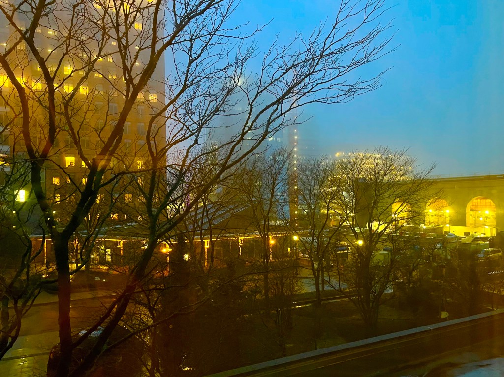View of city from a window at night - it is foggy 