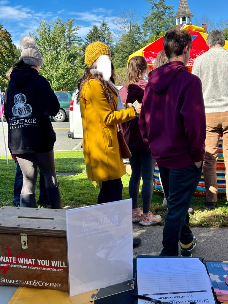 a woman with a gold coat and hat.